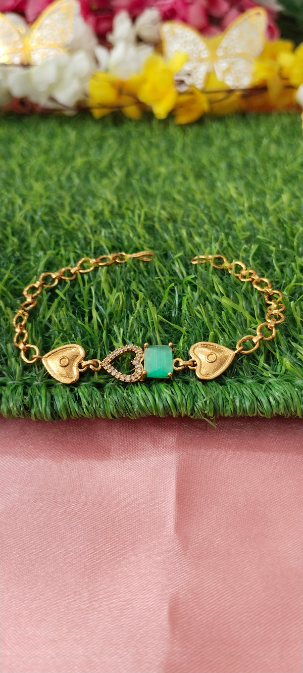 Gold Bracelet with Heart-Shaped Charms