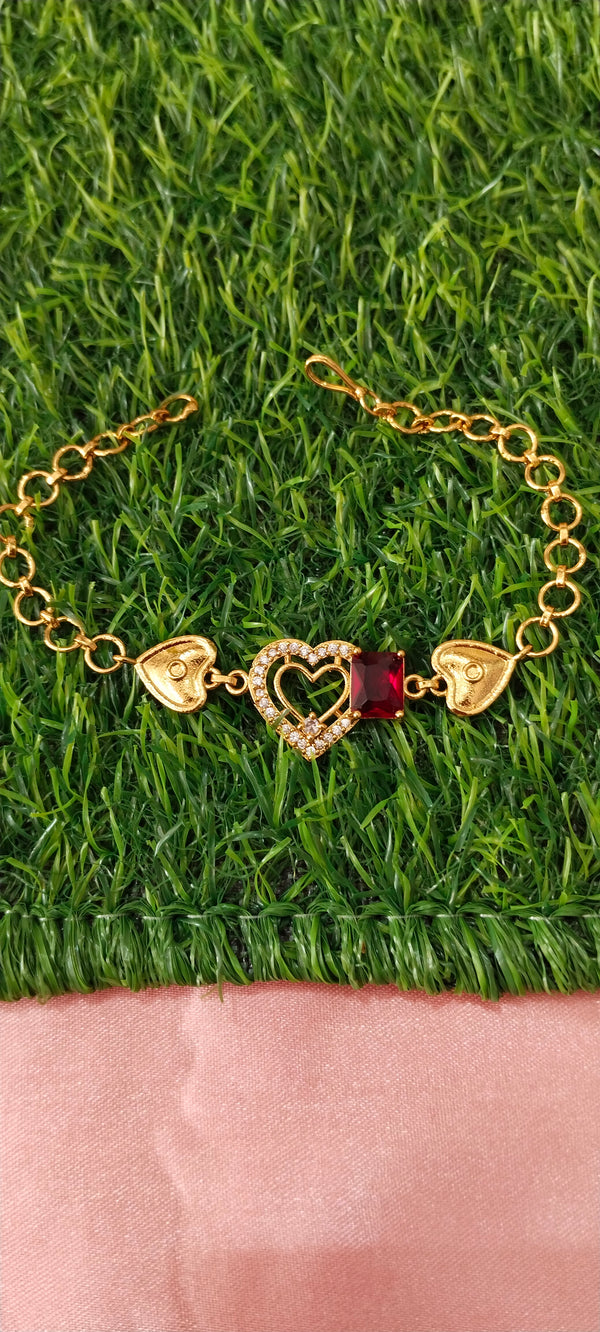 Gold Bracelet with Heart-Shaped Charms with red pendent