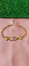 Gold Bracelet with Heart-Shaped Charms with lite pink stone