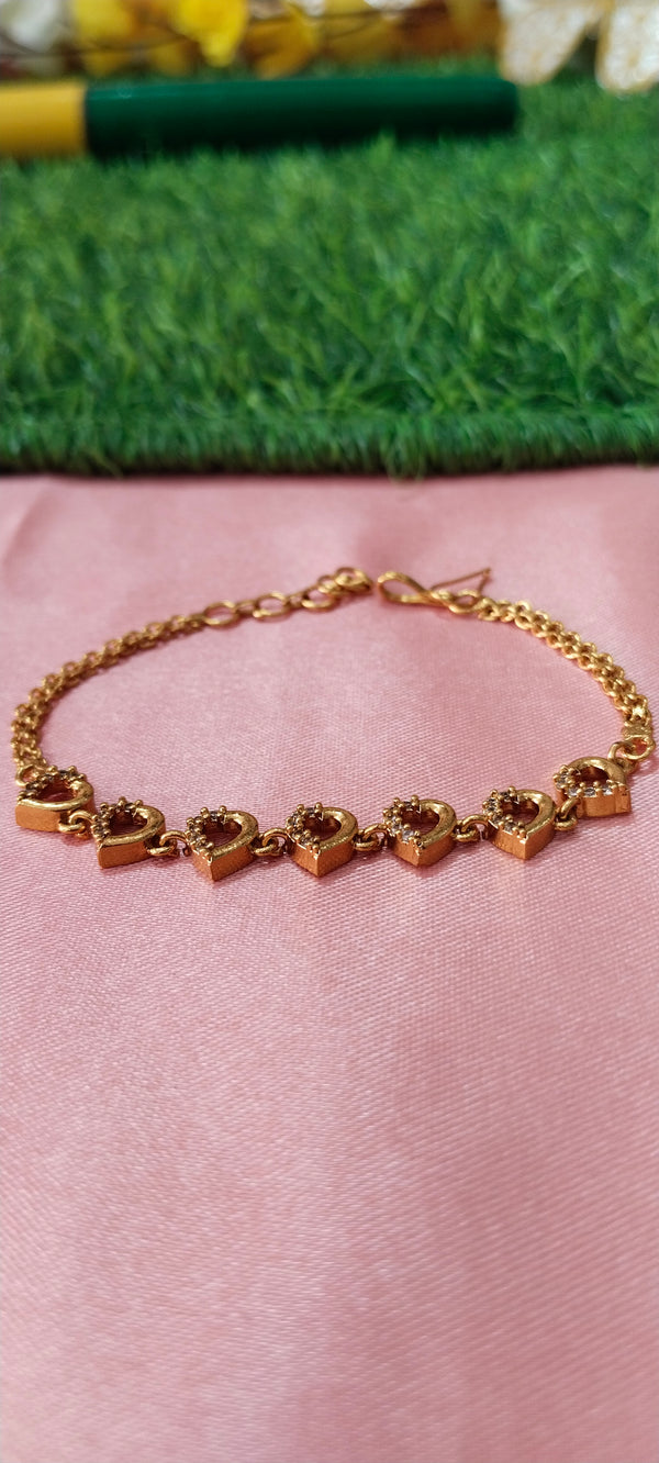 Gold Bracelet with Heart-Shaped Charms