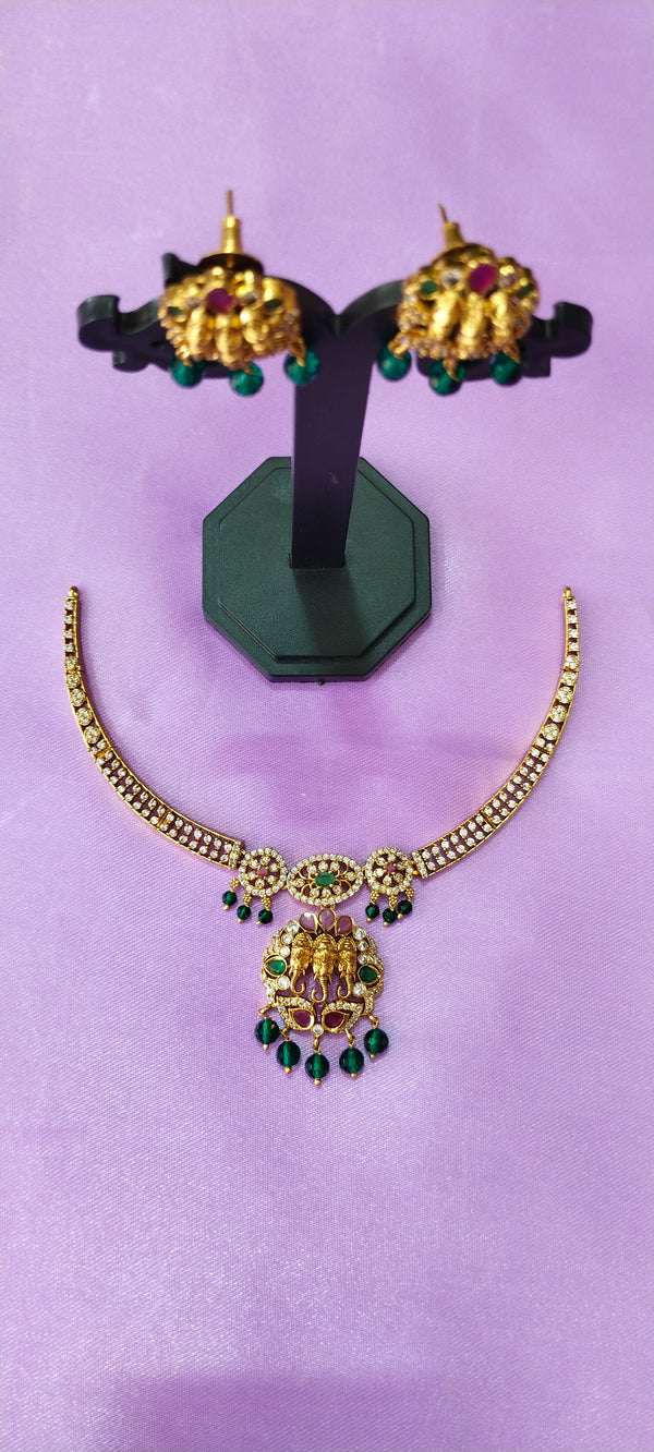 Golden kante cz elephant locket with matching earrings