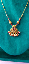 Swan pendant with golden balls and red stones no earrings