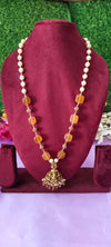 Long premium laxmi locket with gold balls and white pulse and orange stone no earrings