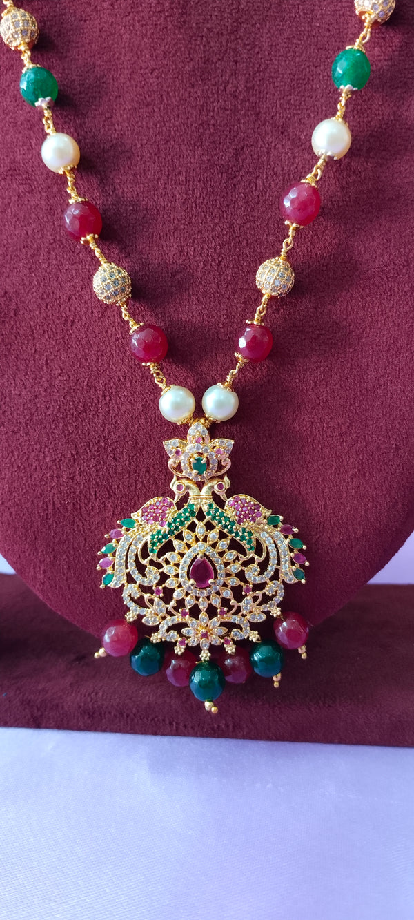 Long chain cz pendant with gold balls with no earrings