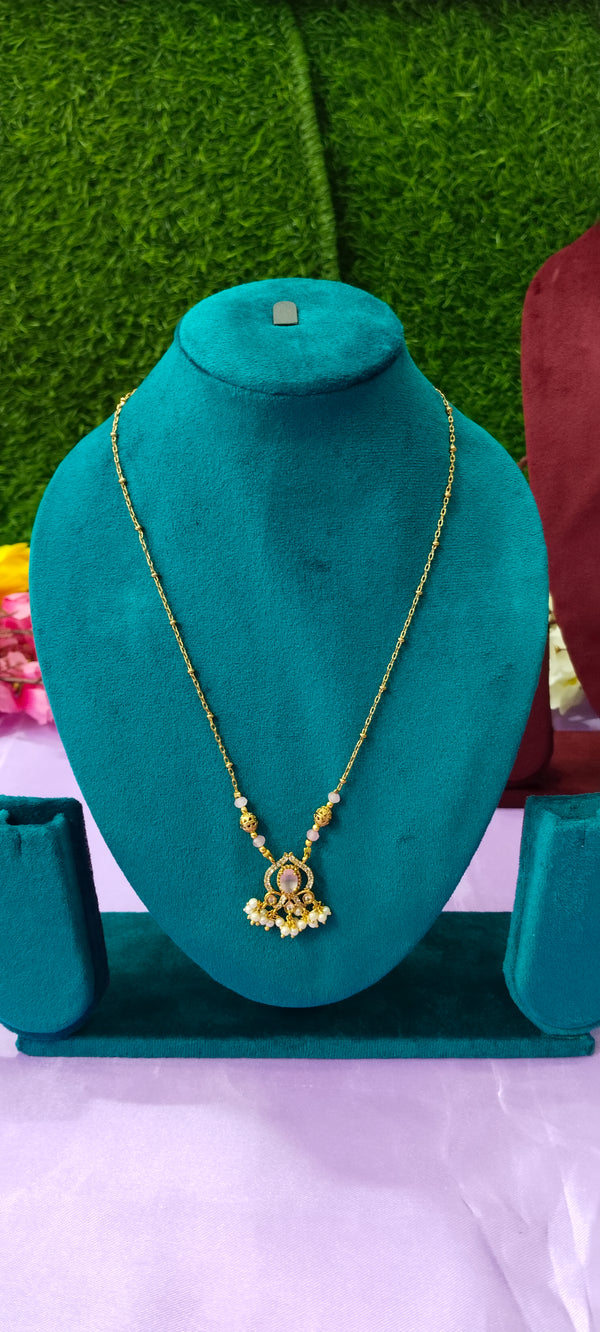 Gold plated peach colour pendant with no earrings