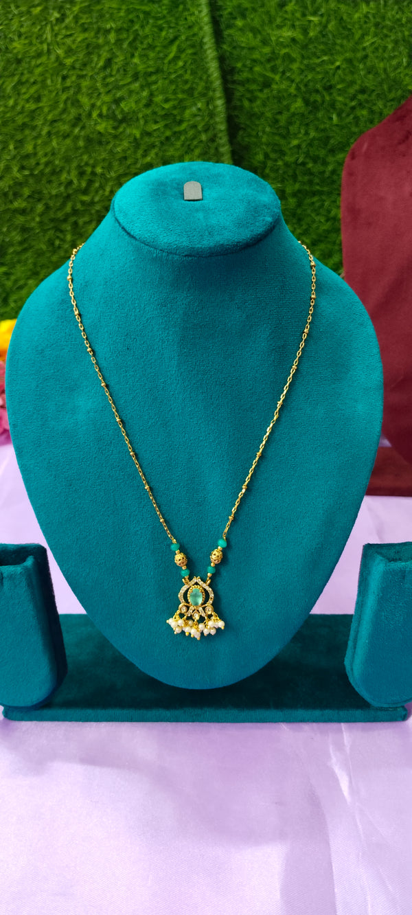 Gold plated Sea green colourpendant with white stone