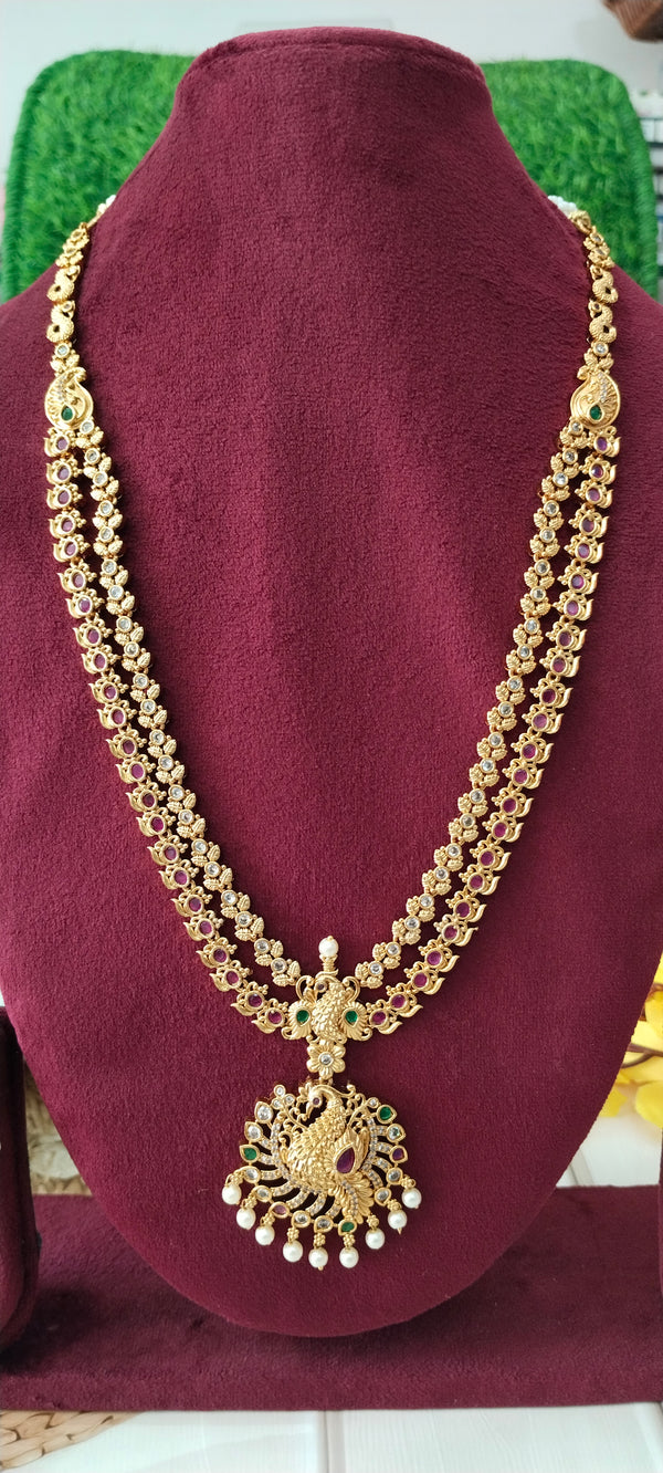 stunning gold-plated long haram featuring an elegant swan locket