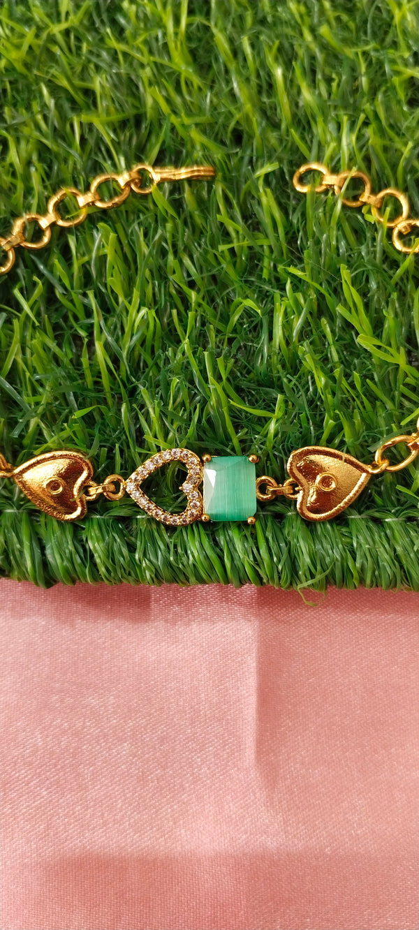 Gold Bracelet with Heart-Shaped Charms
