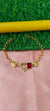 Gold Bracelet with Heart-Shaped Charms with red pendent