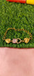 Gold Bracelet with Heart-Shaped Charms with lite pink stone