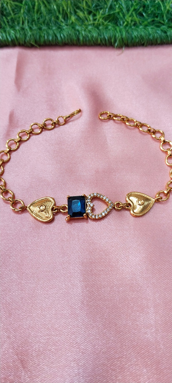Gold Bracelet with Heart-Shaped Charms with blue pendent