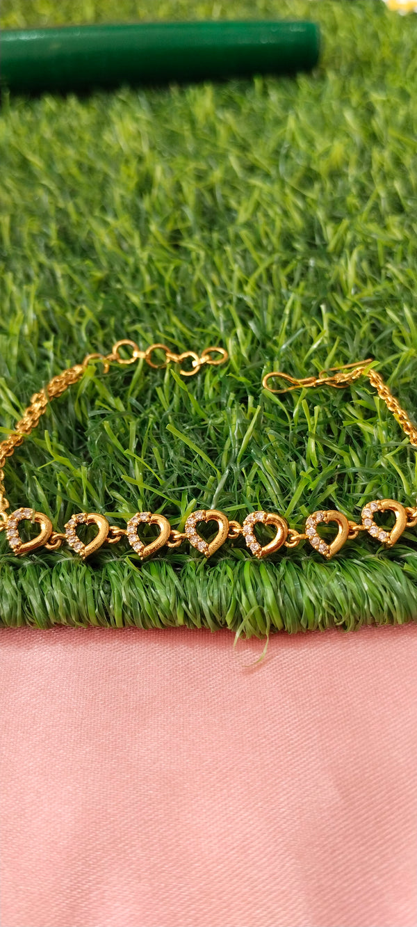Gold Bracelet with Heart-Shaped Charms