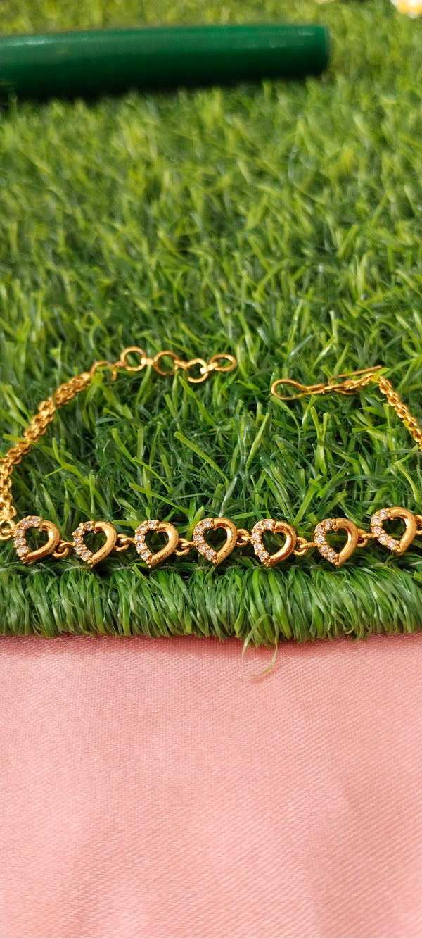 Gold Bracelet with Heart-Shaped Charms