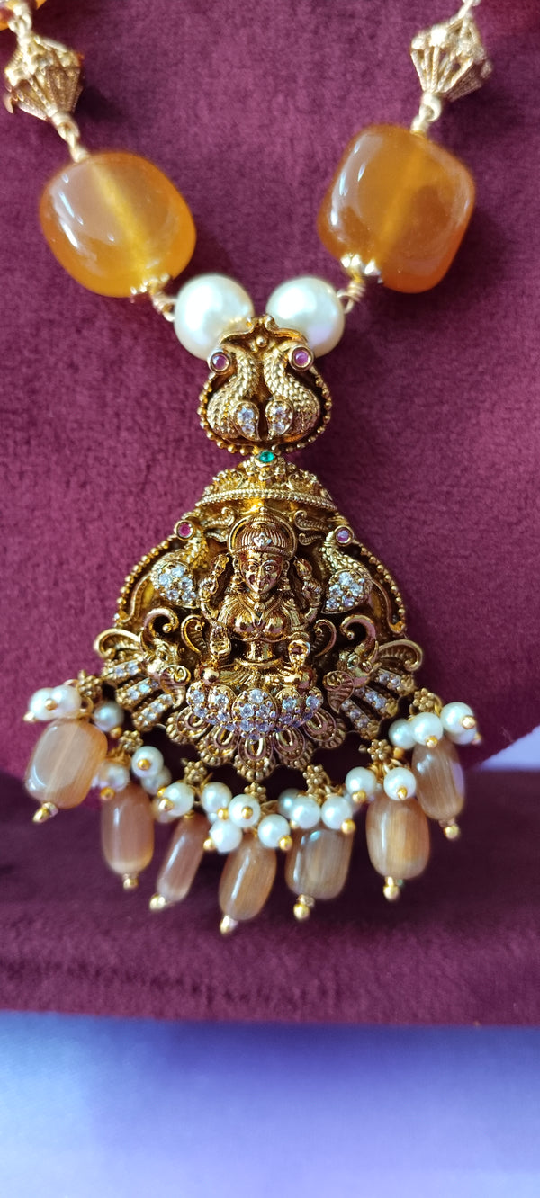 Long premium laxmi locket with gold balls and white pulse and orange stone no earrings