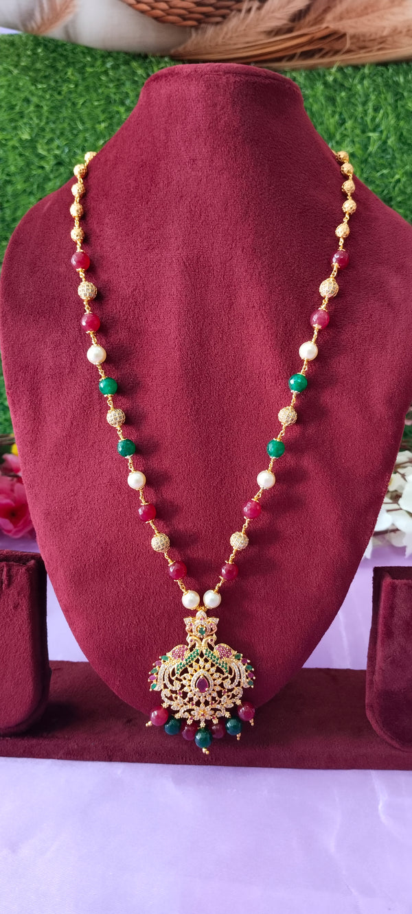 Long chain cz pendant with gold balls with no earrings