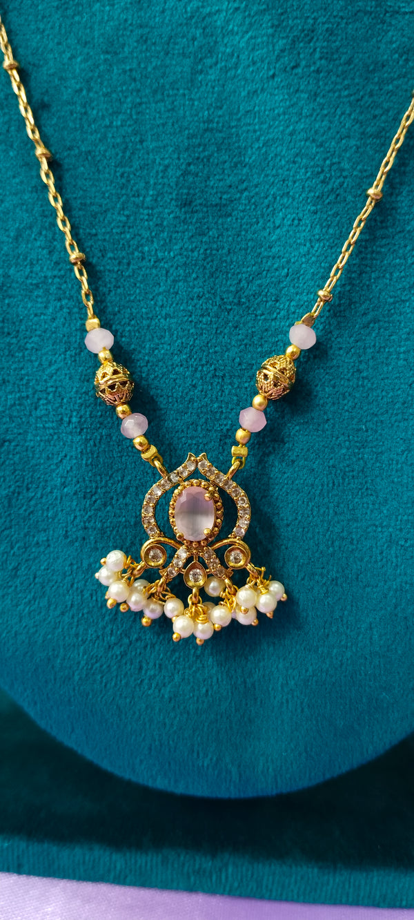 Gold plated peach colour pendant with no earrings