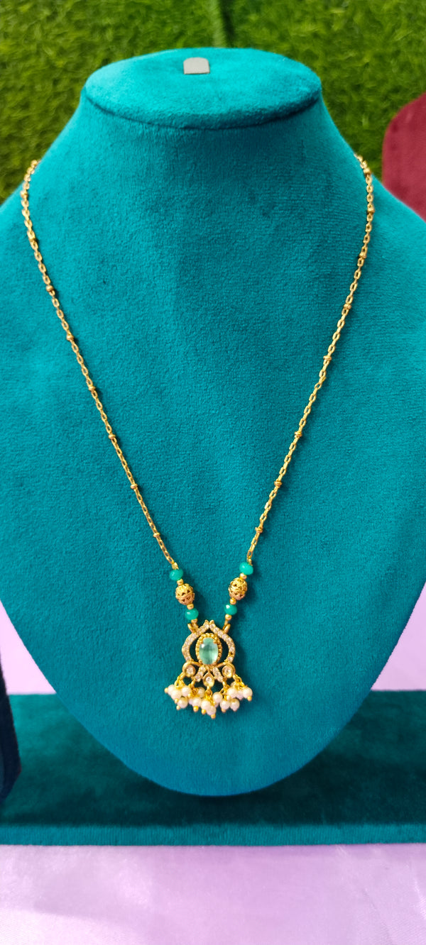 Gold plated Sea green colourpendant with white stone