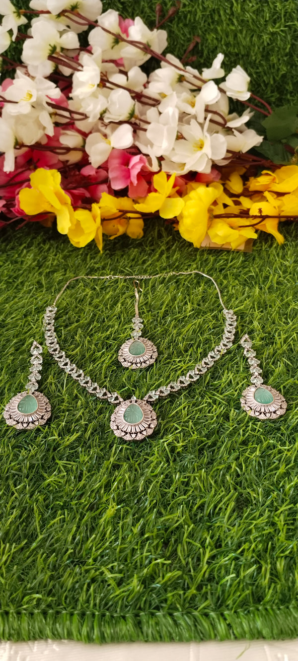 Luxurious american diamond white & sea green pendant with mangtikka